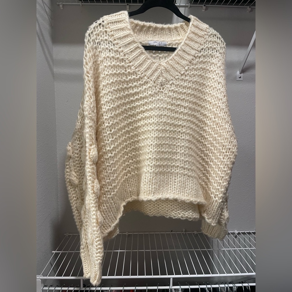 cropped oversized cream knit sweater with large polka-dot detailing